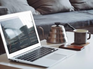 Laptop with cup of tea